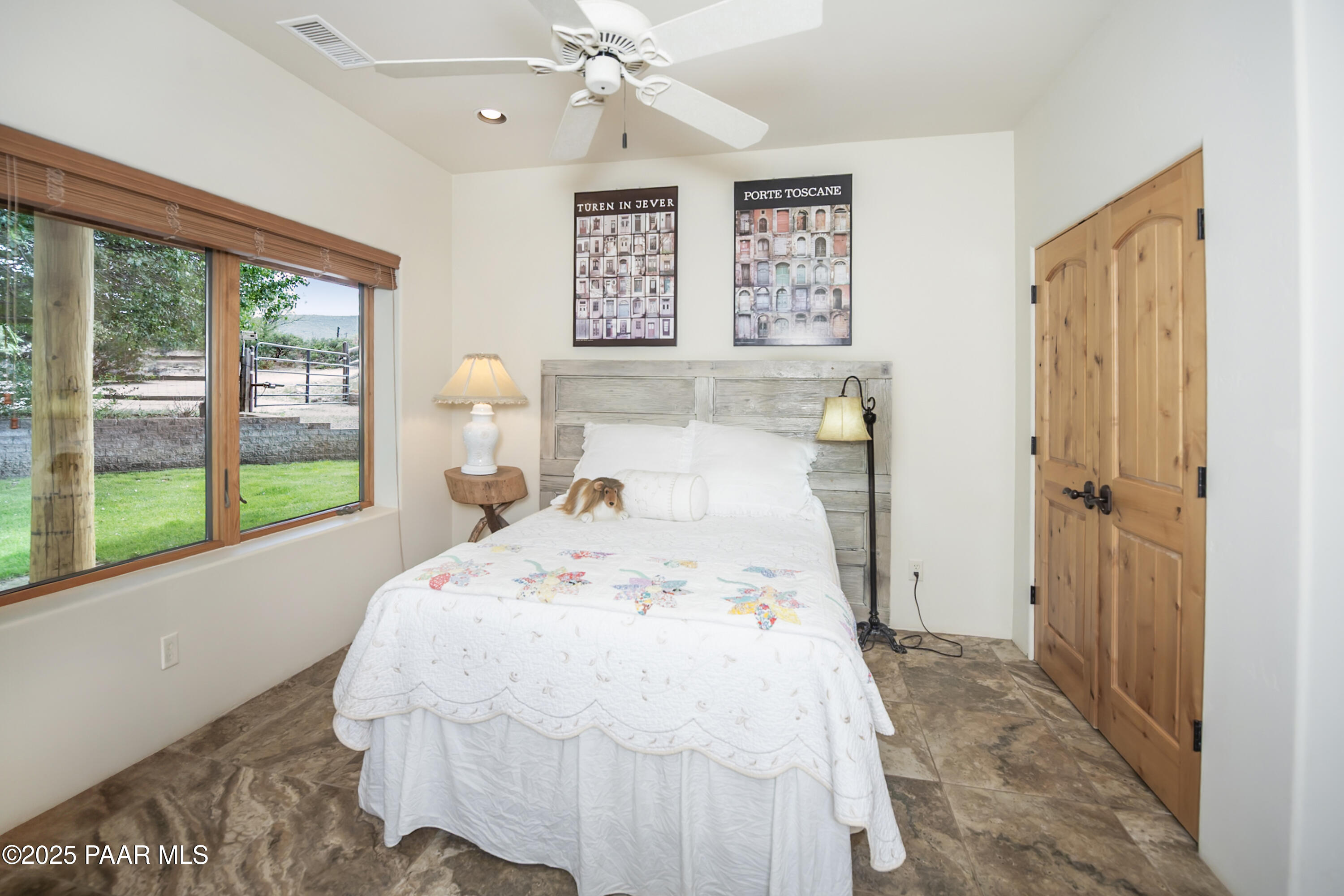 770 Grisby Road Skull Valley, AZ 86338 - Photo 26 of 58 a bed sitting in a bedroom next to a window