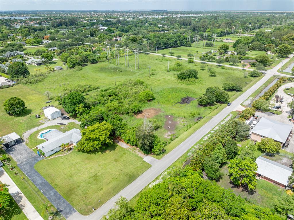 66 Southwest St Ranches Southwest Ranches, FL 33331 - Photo 11 of 14 a view of a garden with a building in the background