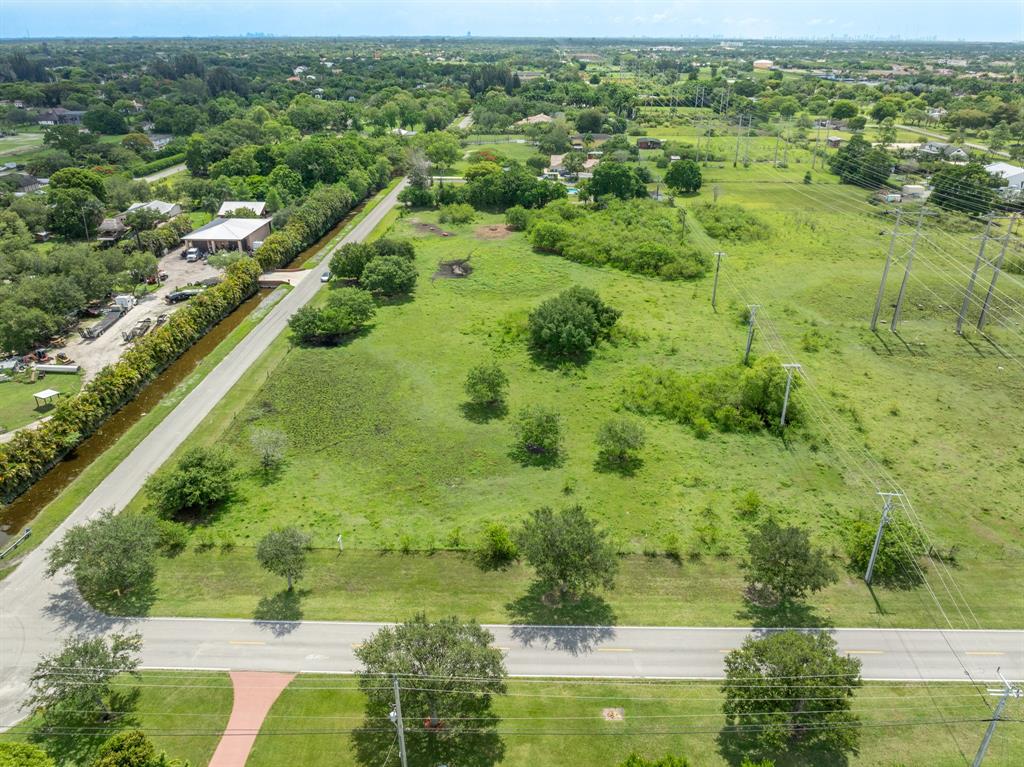66 Southwest St Ranches Southwest Ranches, FL 33331 - Photo 8 of 14 an aerial view of residential houses with outdoor space and trees all around
