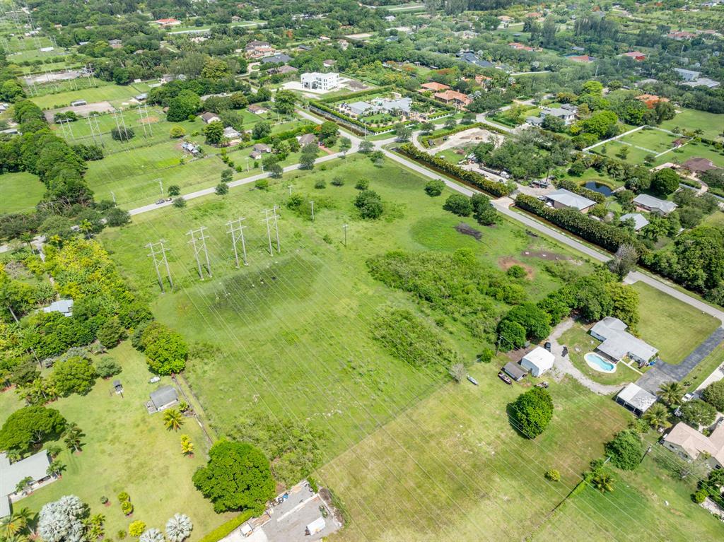 66 Southwest St Ranches Southwest Ranches, FL 33331 - Photo 10 of 14 a view of a yard with yellow plants