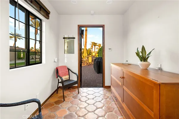 a spacious bathroom with a granite countertop sink a mirror and a shower