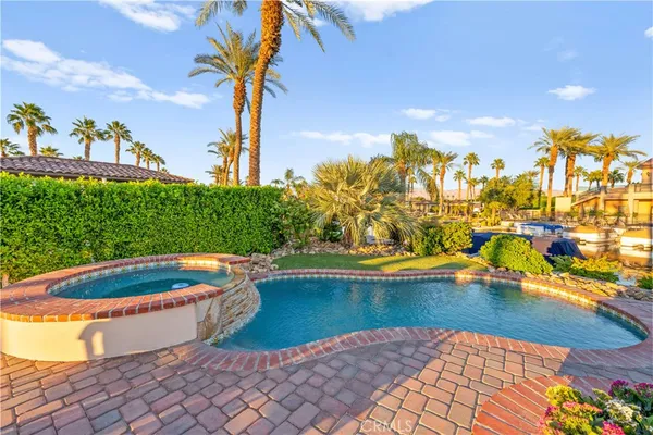 a view of a swimming pool with a lounge chairs