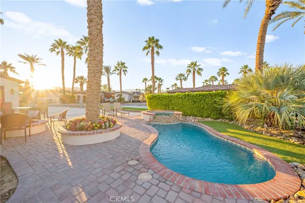 a view of a swimming pool with a lounge chairs