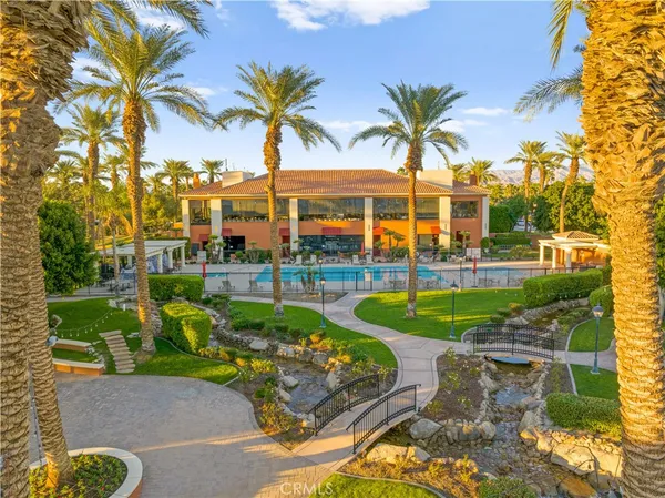 a view of a swimming pool and a lawn chairs