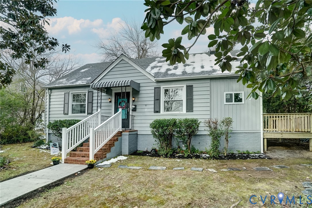 a house that has a tree in front of the house