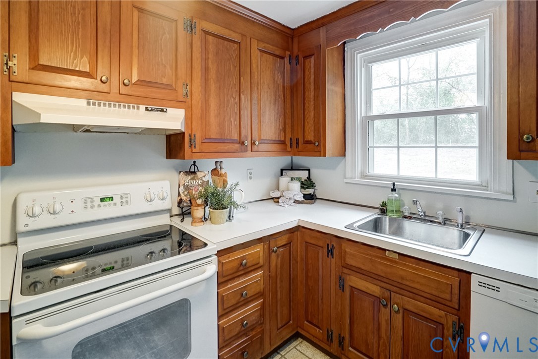 7502 Sweetbriar Road Henrico, VA 23229 - Photo 11 of 28 a kitchen with a sink cabinets and window