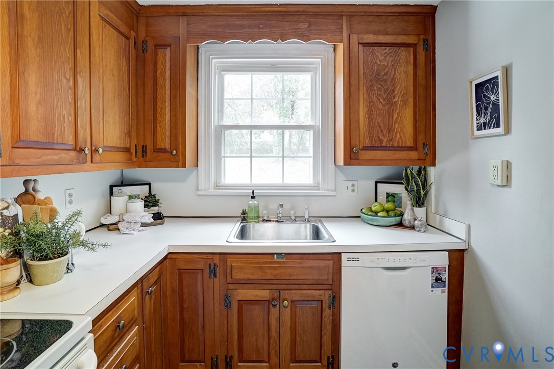 7502 Sweetbriar Road Henrico, VA 23229 - Photo 12 of 28 a kitchen with a sink cabinets and window