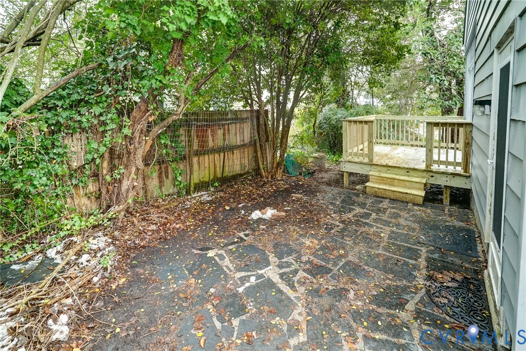 7502 Sweetbriar Road Henrico, VA 23229 - Photo 27 of 28 a porch with a bench and trees