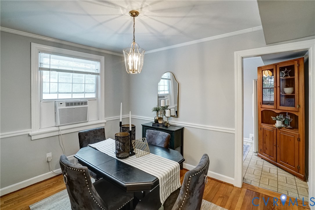 7502 Sweetbriar Road Henrico, VA 23229 - Photo 9 of 28 a view of a dining room with furniture window and wooden floor