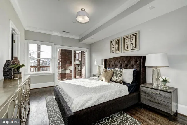 a bedroom with a large bed and a couch