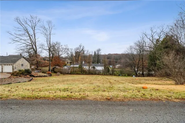 a view of a large pool with a yard