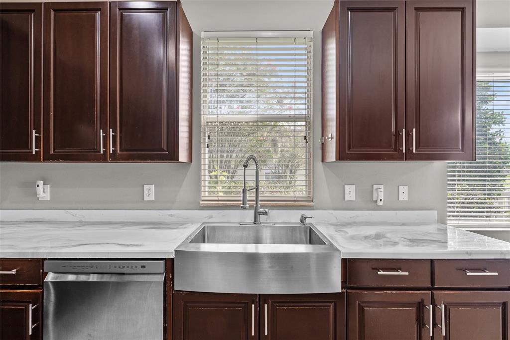 5909 Wedgefield Drive Zephyrhills, FL 33541 - Photo 11 of 54 a kitchen with granite countertop a sink and a stove
