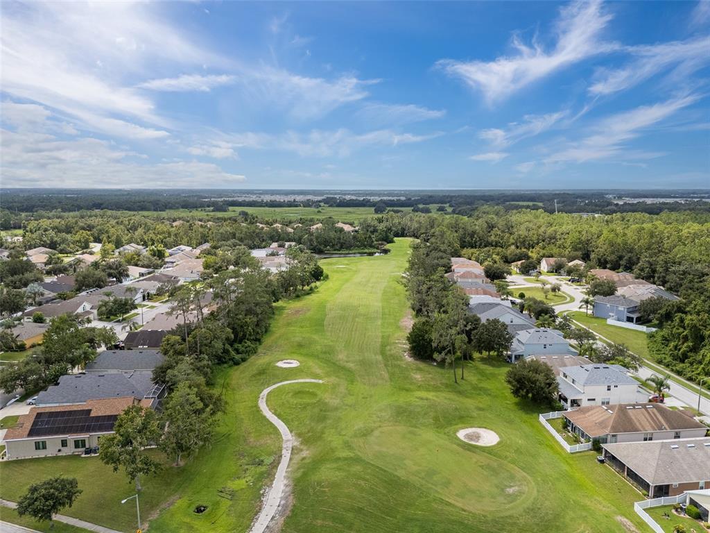 5909 Wedgefield Drive Zephyrhills, FL 33541 - Photo 27 of 54 an aerial view of residential house with outdoor space