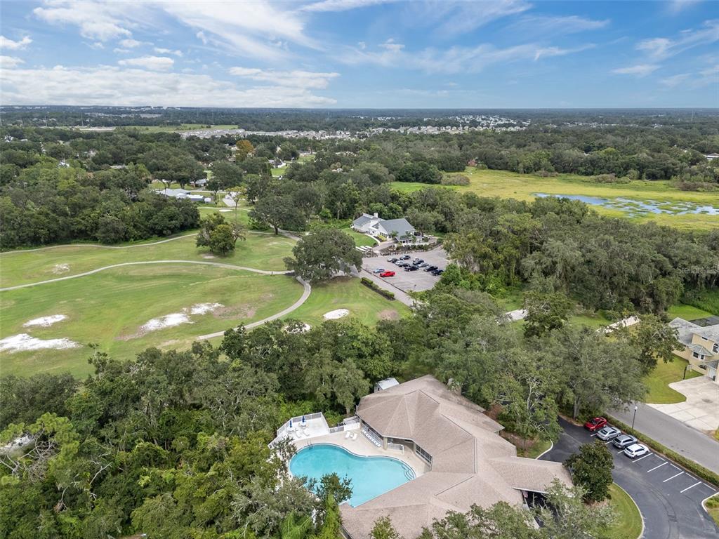 5909 Wedgefield Drive Zephyrhills, FL 33541 - Photo 30 of 54 a view of a city with mountains in the background
