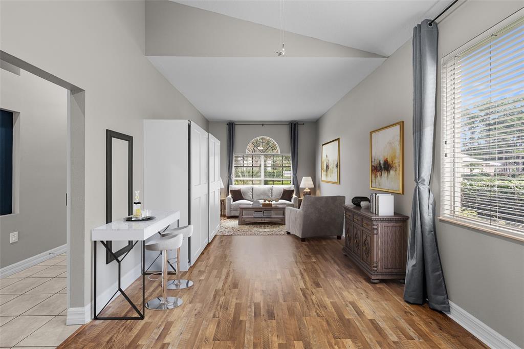 5909 Wedgefield Drive Zephyrhills, FL 33541 - Photo 3 of 54 a living room with furniture