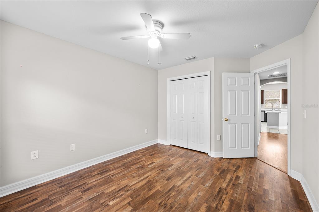 5909 Wedgefield Drive Zephyrhills, FL 33541 - Photo 42 of 54 a view of empty room with wooden floor