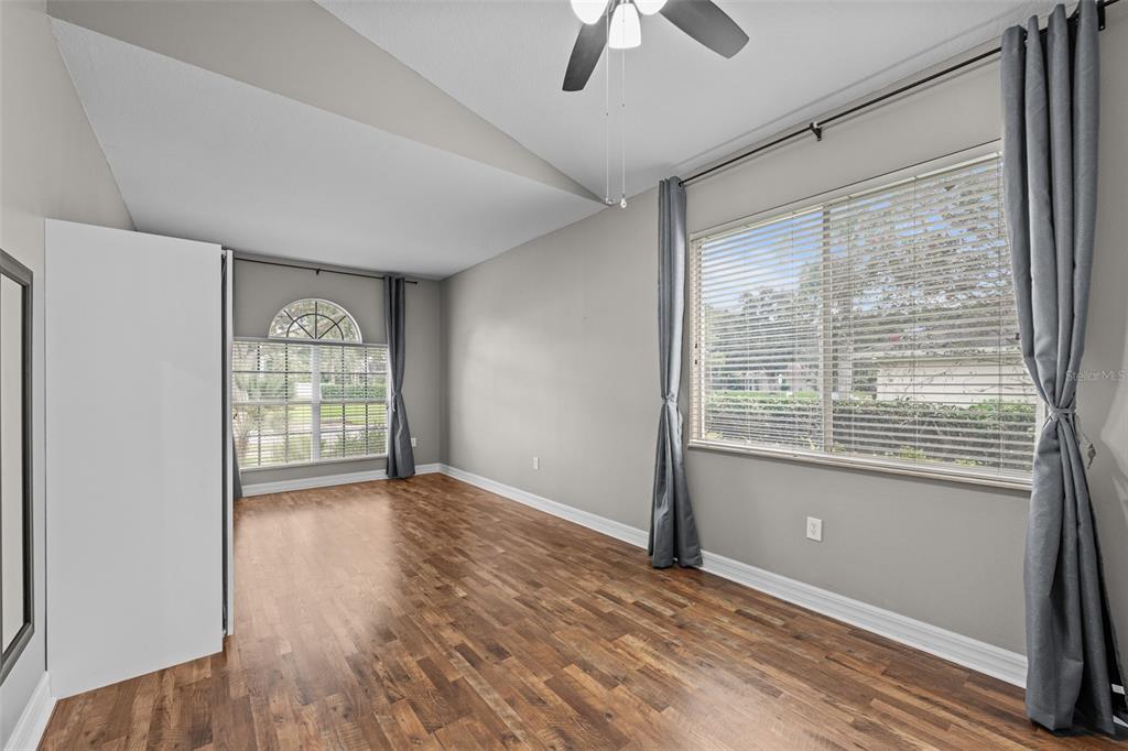 5909 Wedgefield Drive Zephyrhills, FL 33541 - Photo 44 of 54 a view of an empty room with a window and wooden floor
