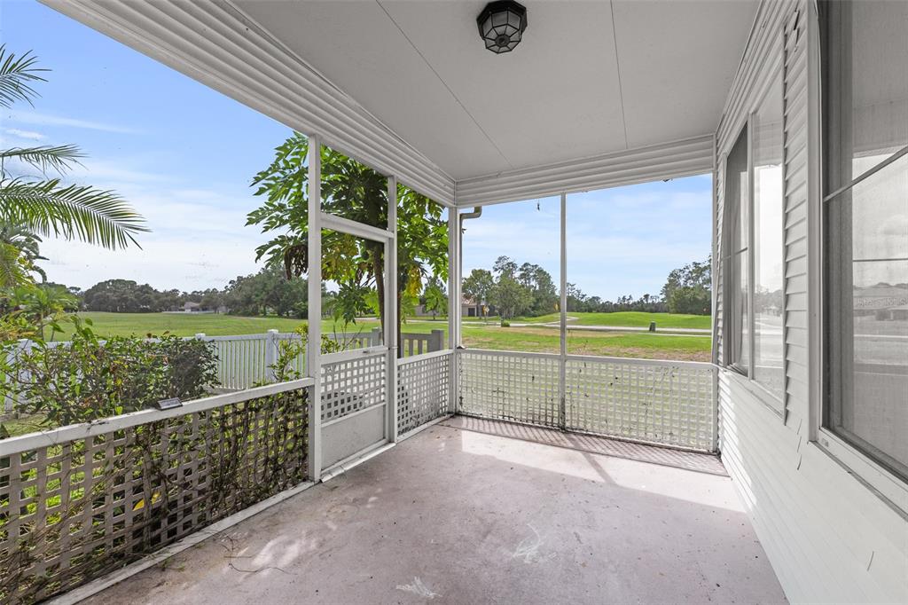 5909 Wedgefield Drive Zephyrhills, FL 33541 - Photo 49 of 54 a view of a porch and garden