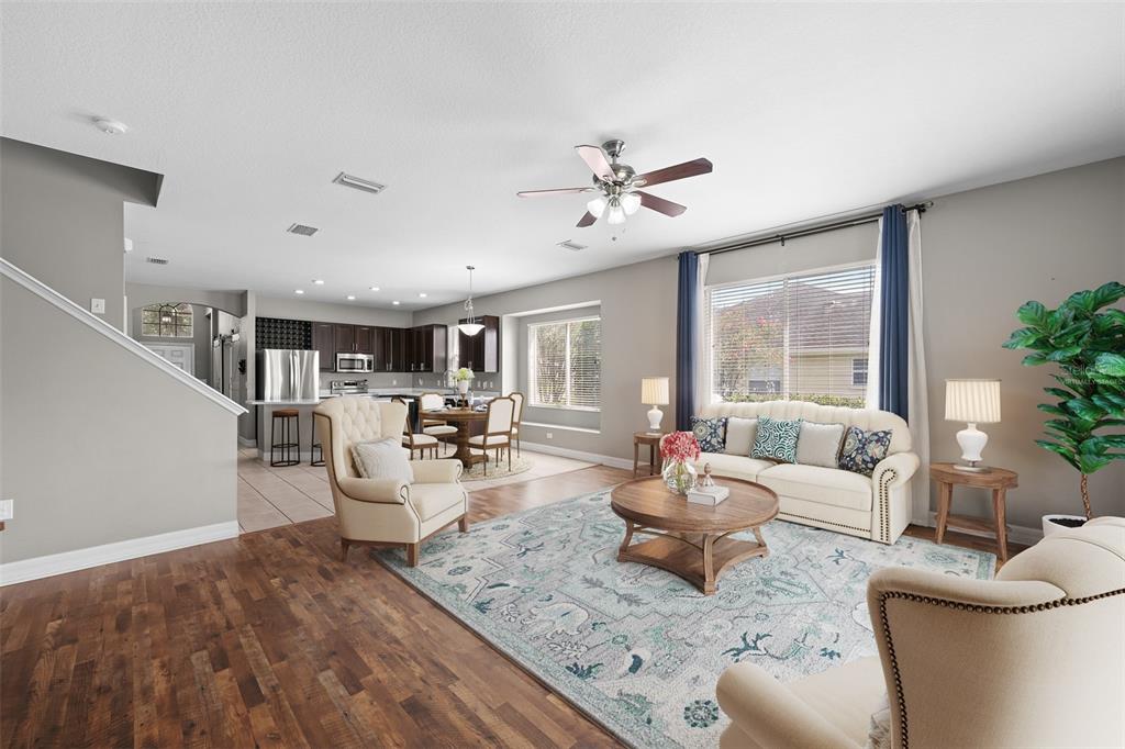 5909 Wedgefield Drive Zephyrhills, FL 33541 - Photo 5 of 54 a living room with furniture and a large window