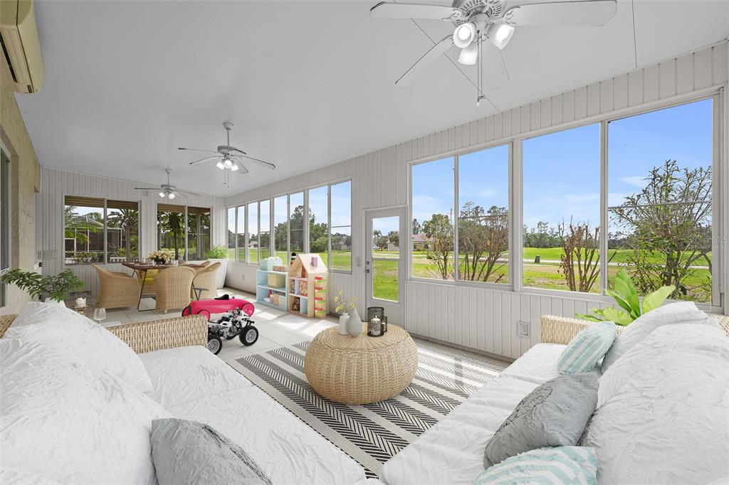 5909 Wedgefield Drive Zephyrhills, FL 33541 - Photo 9 of 54 a living room with furniture and a large window