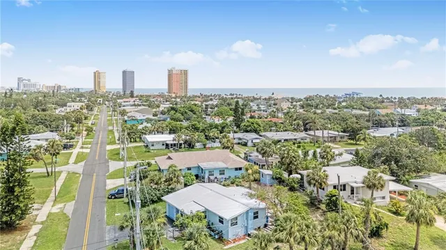 an aerial view of city and trees
