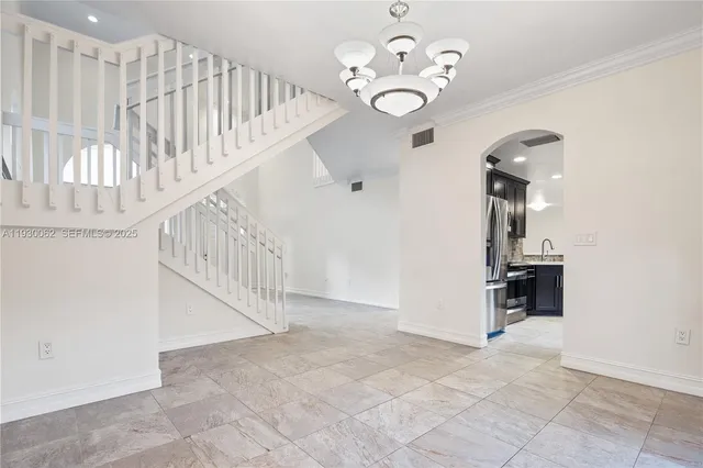 a view of a hallway view with staircase