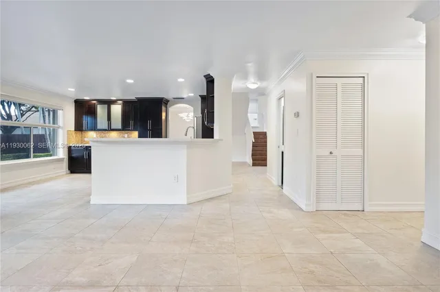 a view of kitchen and refrigerator