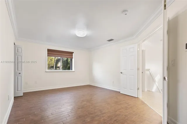 a bathroom with a granite countertop toilet a sink and a mirror