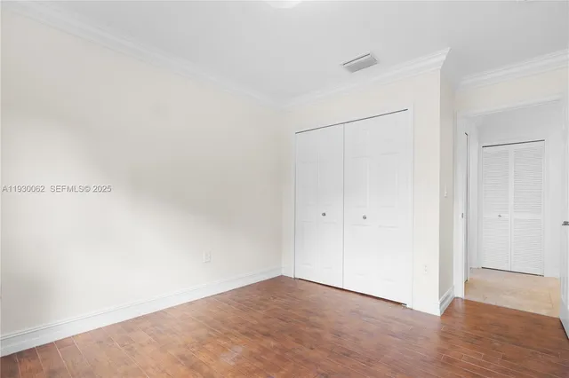 a view of a bathroom with wooden floor
