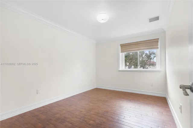 a view of a hallway with wooden walls
