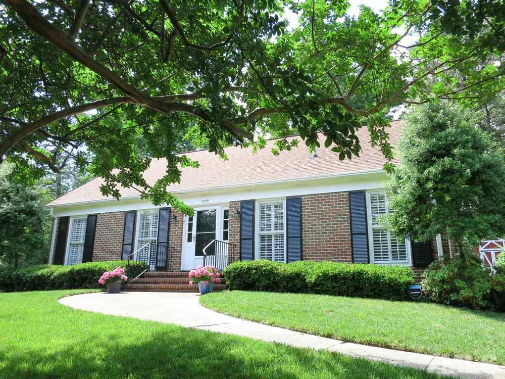 5215 Knollwood Road Raleigh, NC 27609 - Photo 2 of 30 a front view of a house with yard and green space