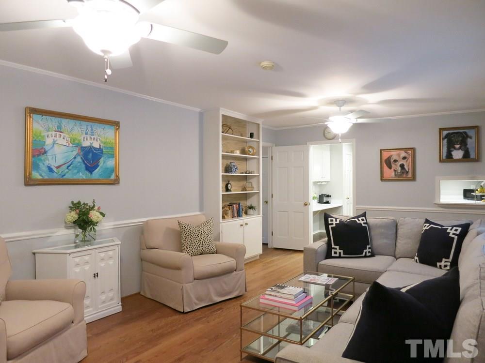 5215 Knollwood Road Raleigh, NC 27609 - Photo 15 of 30 a living room with furniture and a potted plant