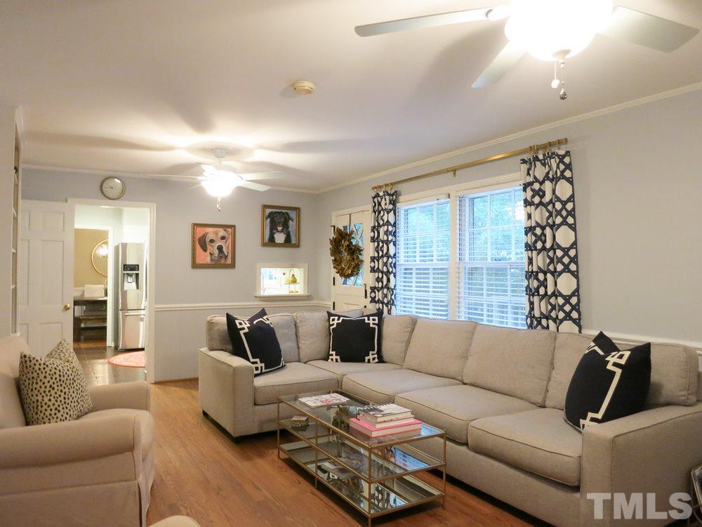 5215 Knollwood Road Raleigh, NC 27609 - Photo 16 of 30 a living room with furniture and a large window