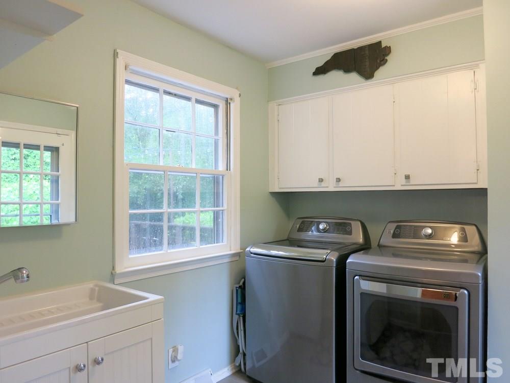 5215 Knollwood Road Raleigh, NC 27609 - Photo 17 of 30 a utility room with dryer and washer