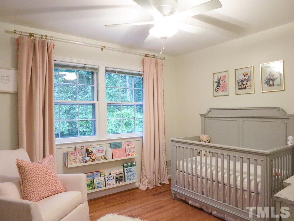 5215 Knollwood Road Raleigh, NC 27609 - Photo 25 of 30 a living room with furniture and a window