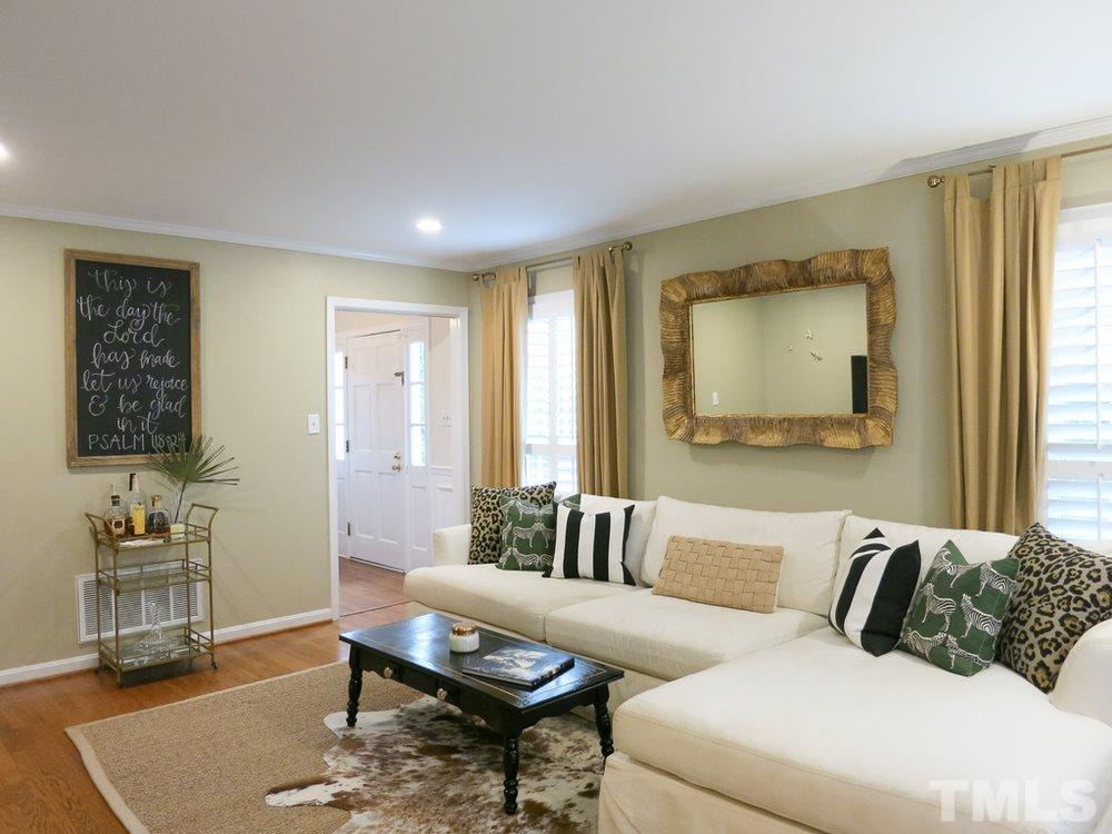 5215 Knollwood Road Raleigh, NC 27609 - Photo 4 of 30 a living room with furniture and a window