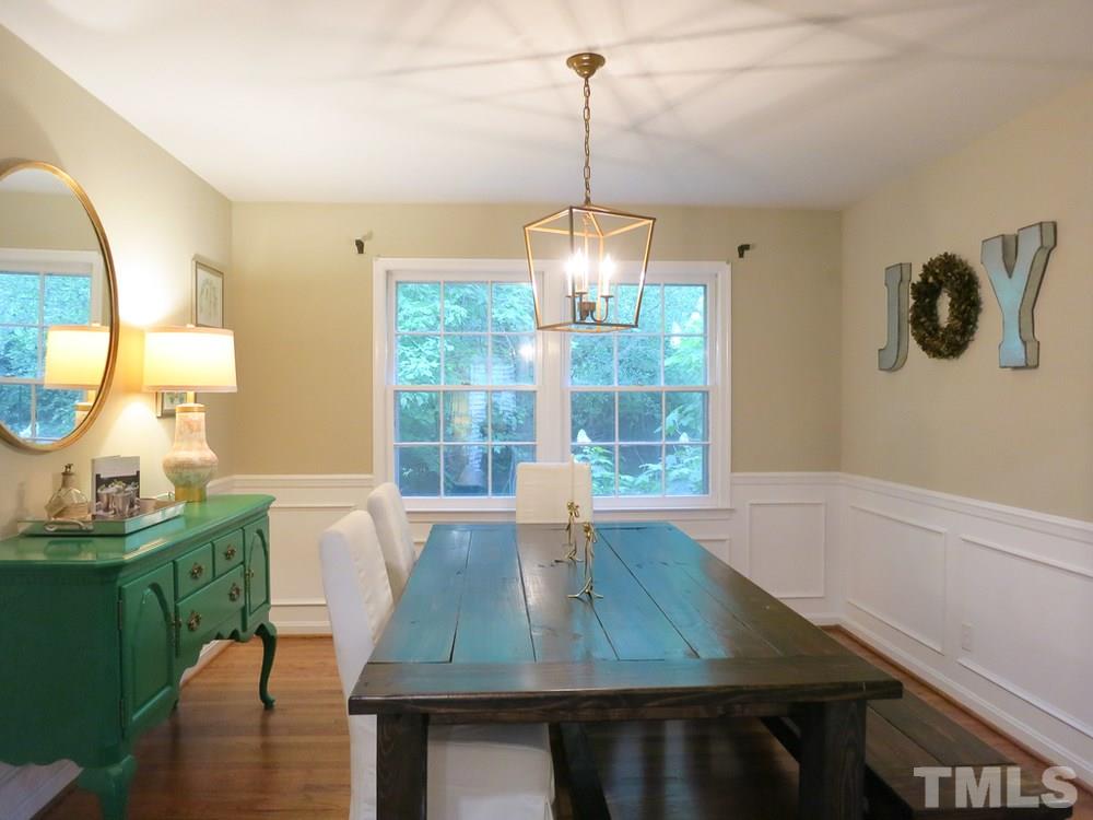 5215 Knollwood Road Raleigh, NC 27609 - Photo 7 of 30 a view of a dining room with furniture window and outside view