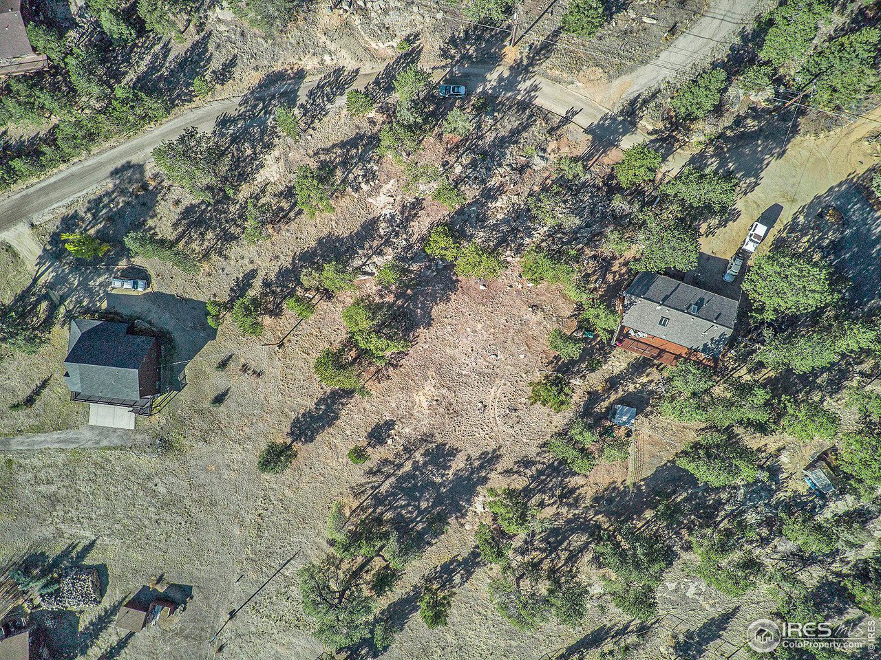 2630 Ridge Lane Estes Park, CO 80517 - Photo 22 of 31 a view of a wooden house with a yard