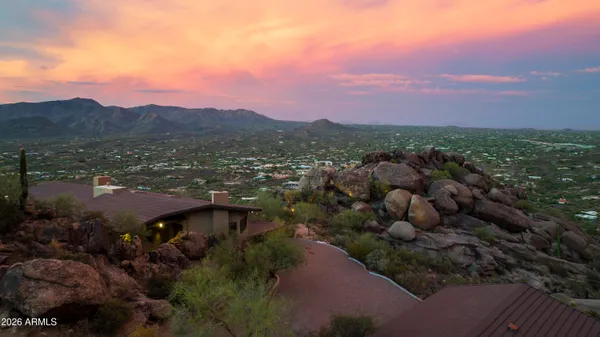 a view of a city with mountains in the background