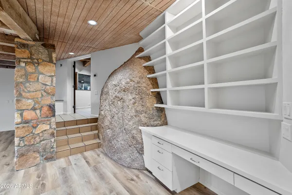 a large kitchen with a sink and cabinets