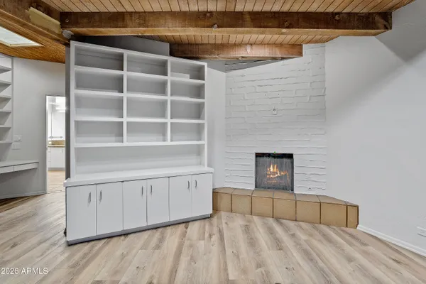 a view of an empty room and a window