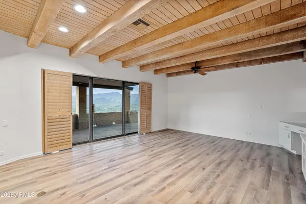 a large white kitchen with cabinets a sink and a stove