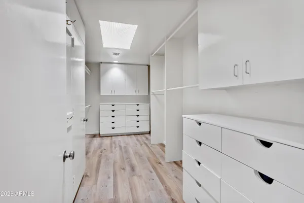 a bathroom with a sink a toilet and a shower