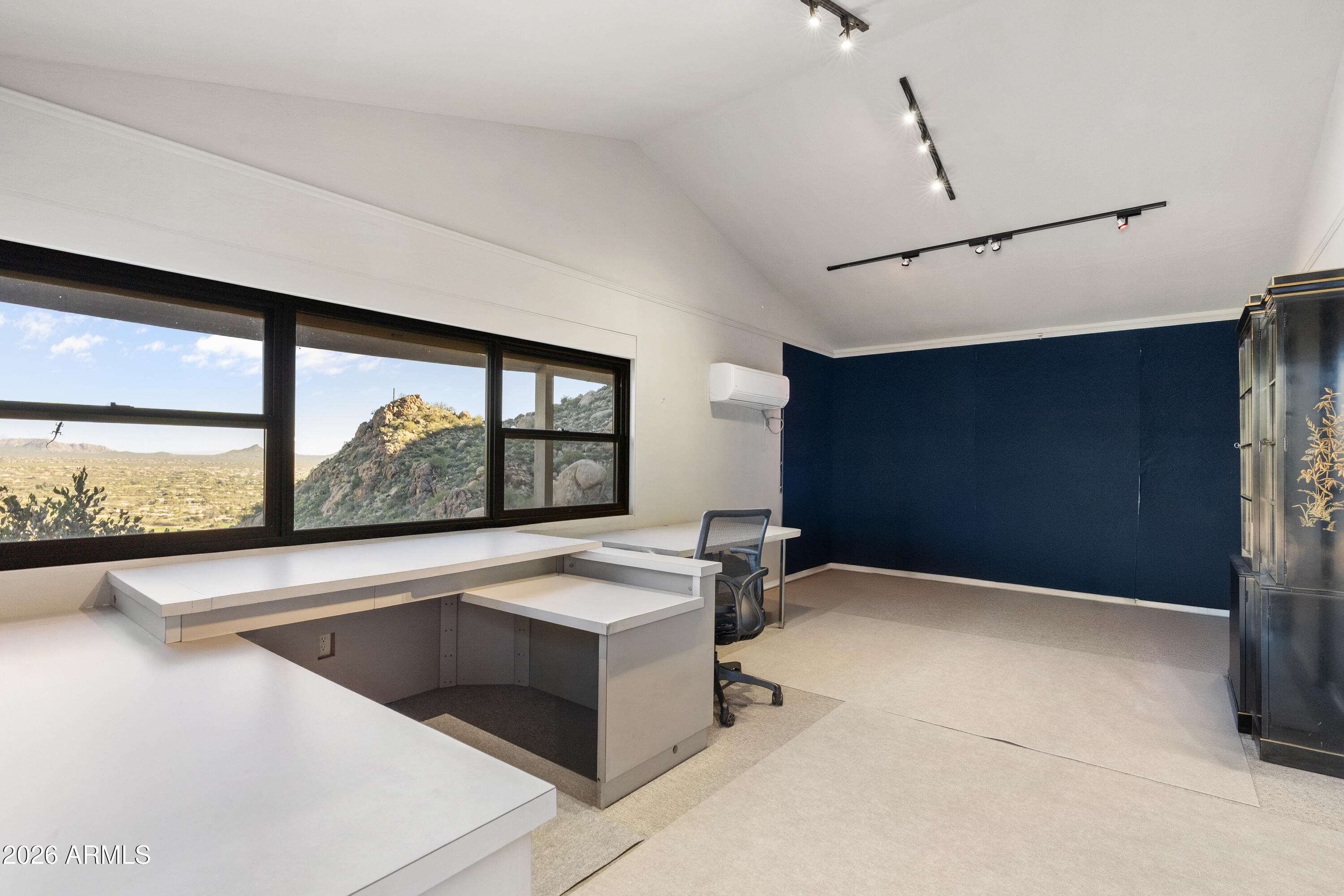 6700 East Hawksnest Road Carefree, AZ 85377 - Photo 52 of 82 a view of an empty room with a window and kitchen view