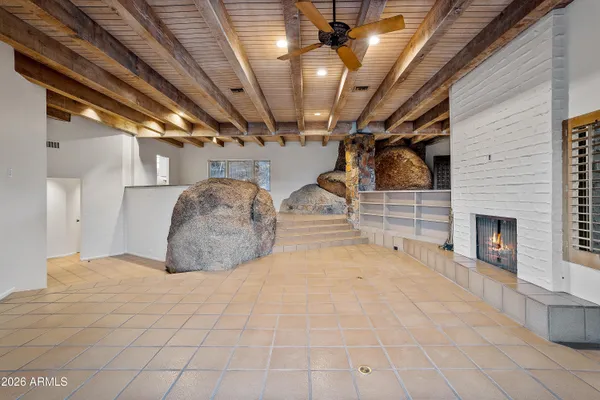 a view of a livingroom with a white kitchen