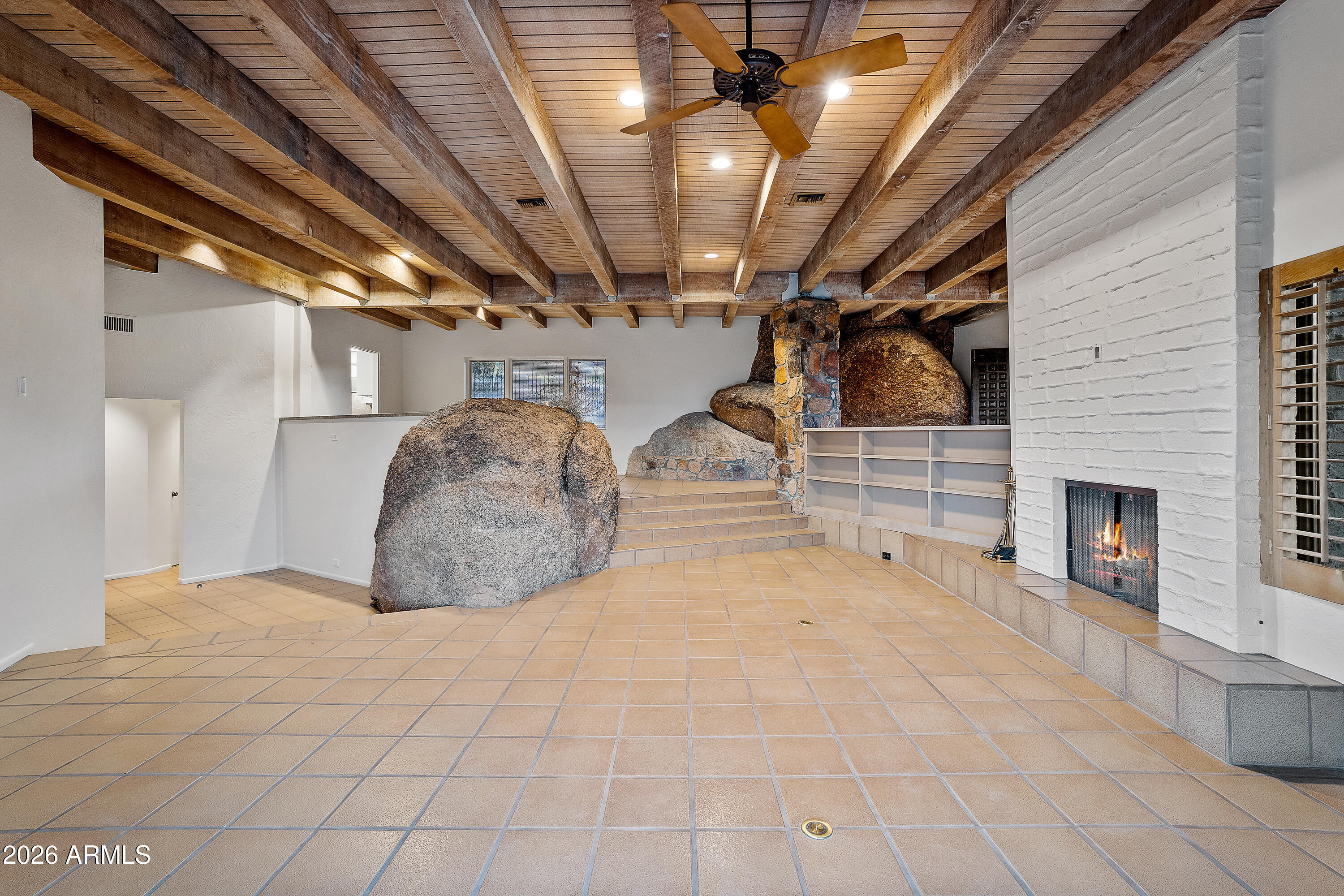 6700 East Hawksnest Road Carefree, AZ 85377 - Photo 6 of 82 a view of a livingroom with fireplace and furniture