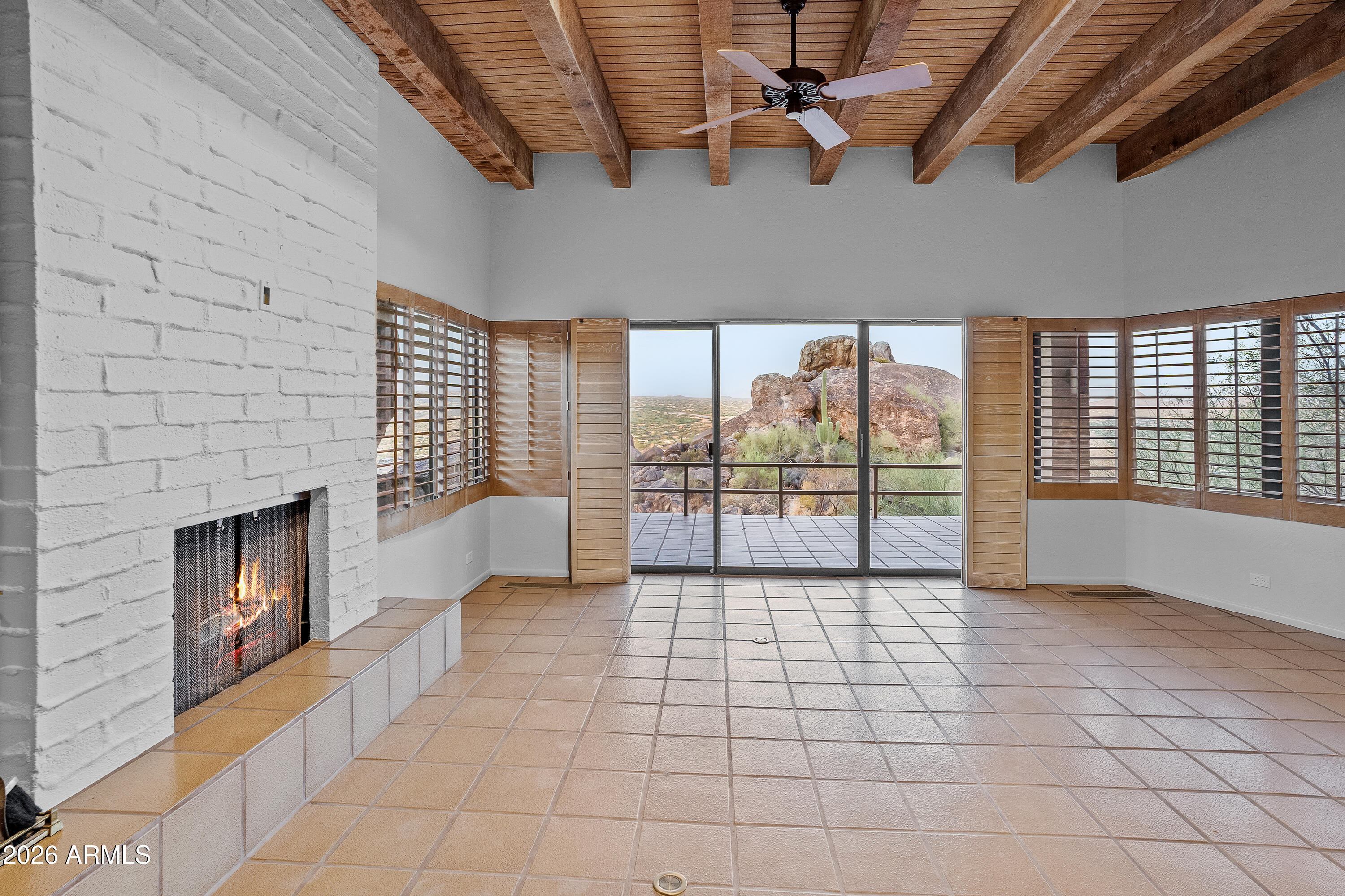 6700 East Hawksnest Road Carefree, AZ 85377 - Photo 8 of 82 a view of an empty room with a fireplace