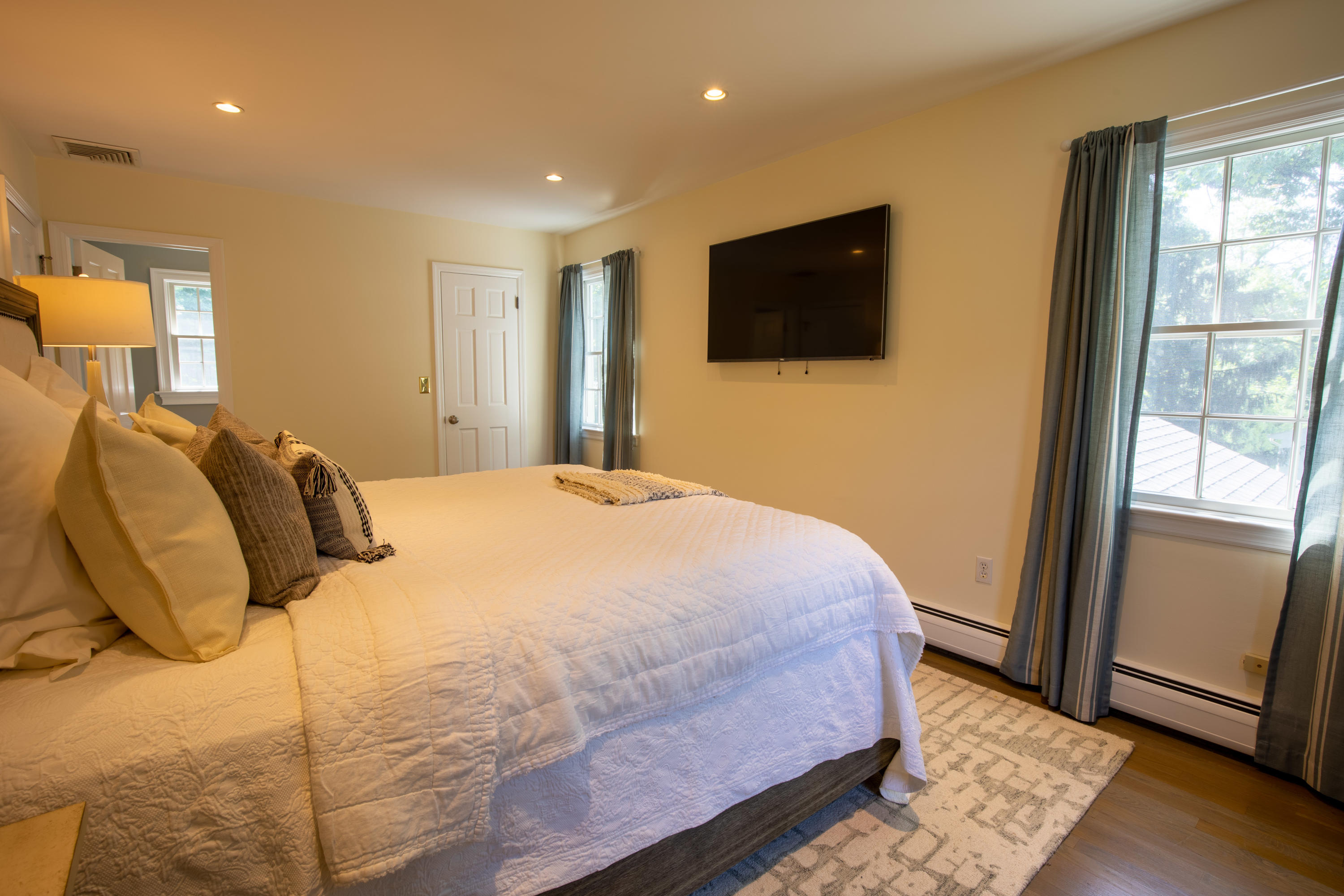 10 Old Field Road Norwalk, CT 06853 - Photo 11 of 21 a bedroom with a bed and a flat screen tv