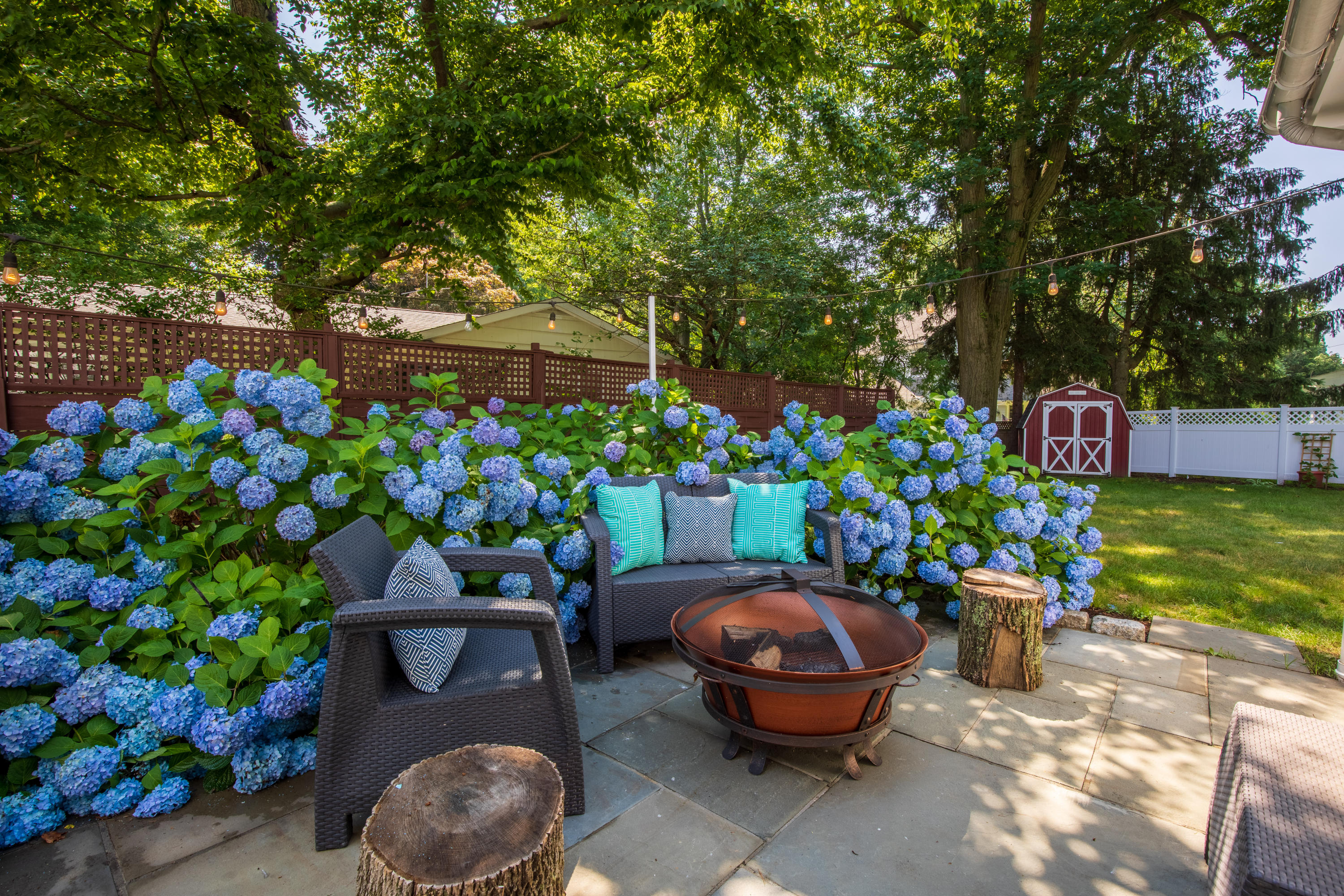 10 Old Field Road Norwalk, CT 06853 - Photo 16 of 21 a view of a backyard with plants and a patio