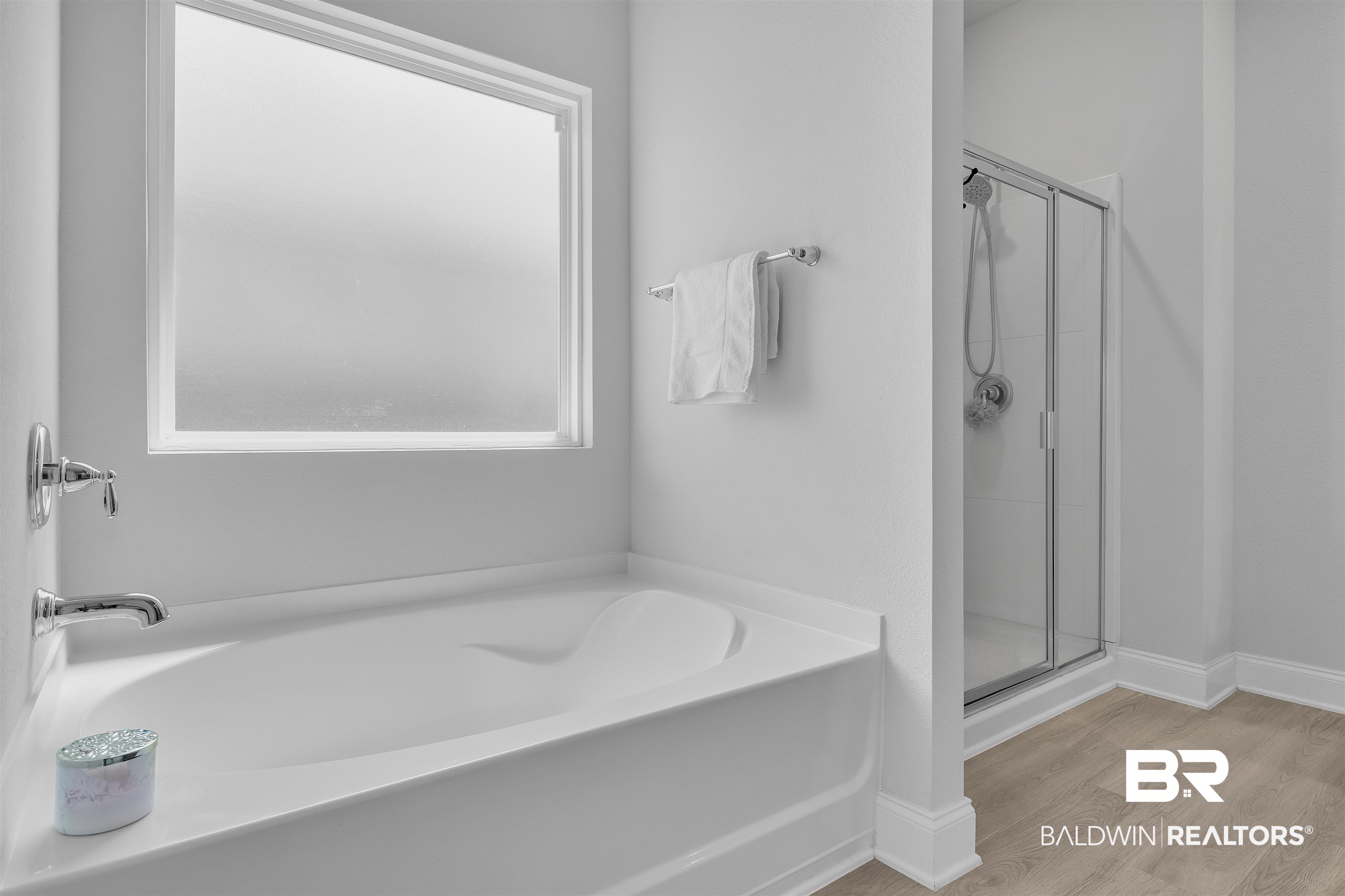 27862 Jade Court Daphne, AL 36526 - Photo 28 of 33 Bathroom featuring a garden tub, wood finished floors, and a stall shower